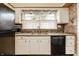 Kitchen with granite counters, tile backsplash, stainless appliances and white cabinets at 4912 Central Ave, Indianapolis, IN 46205