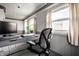 Bright office space featuring desk, a large picture window, and neutral color palette at 4912 Central Ave, Indianapolis, IN 46205