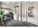 Bright office space with a desk, shelving, and glass door access to other parts of the home at 4912 Central Ave, Indianapolis, IN 46205