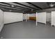 Large unfinished basement area with visible beams and pipes, offering ample space for customization at 4933 W 13Th W St, Speedway, IN 46224