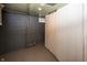 An unfinished basement space featuring concrete block walls, exposed plumbing, and storage potential at 4933 W 13Th W St, Speedway, IN 46224