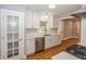 Well-lit kitchen featuring modern cabinets, stainless appliances, and bright white subway tile at 4933 W 13Th W St, Speedway, IN 46224
