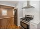 Modern kitchen showcasing stainless steel appliances and bright white subway tile at 4933 W 13Th W St, Speedway, IN 46224