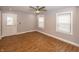 Inviting living room featuring abundant natural light, wood flooring, and neutral walls at 4933 W 13Th W St, Speedway, IN 46224