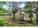 Backyard with stone facade, grilling area, and outdoor storage shed, perfect for entertaining and relaxation at 4990 E County Road 750 S, Brownsburg, IN 46112