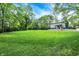 A large building in a backyard surrounded by mature trees with a large green lawn at 4990 E County Road 750 S, Brownsburg, IN 46112