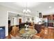 Open dining and living area with hardwood floors, ample seating, and stylish décor at 4990 E County Road 750 S, Brownsburg, IN 46112