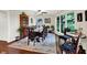 Spacious dining area with wooden table, colorful rug, and natural light from large windows at 4990 E County Road 750 S, Brownsburg, IN 46112