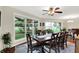 Bright dining room with a large window, hardwood floors, and ample seating at 4990 E County Road 750 S, Brownsburg, IN 46112