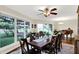 Sunlit dining room showcasing a large table, hardwood floors, and expansive windows at 4990 E County Road 750 S, Brownsburg, IN 46112