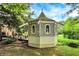 Charming gazebo featuring decorative lattice panels, a unique roof, and a serene backyard setting at 4990 E County Road 750 S, Brownsburg, IN 46112