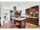 Bright kitchen showcasing a center island, stainless appliances, and hardwood flooring at 4990 E County Road 750 S, Brownsburg, IN 46112