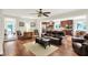 Open concept living room and kitchen area with hardwood floors and modern furnishings at 4990 E County Road 750 S, Brownsburg, IN 46112