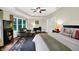 Main bedroom featuring sitting area, dark wood floors, and large windows at 4990 E County Road 750 S, Brownsburg, IN 46112