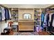 Spacious walk-in closet with custom built-in shelving and drawers, offering ample storage space for clothing at 4990 E County Road 750 S, Brownsburg, IN 46112