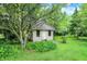 A small building in a backyard with green grass and trees at 4990 E County Road 750 S, Brownsburg, IN 46112