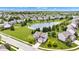 An aerial view of a home in a neighborhood with a scenic pond and mature trees at 515 Lynton Way, Westfield, IN 46074