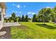 Expansive backyard featuring lush greenery and mature trees, offering privacy and a serene setting at 515 Lynton Way, Westfield, IN 46074