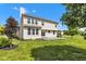 A spacious, well-maintained backyard with a patio and lush green grass, perfect for outdoor entertaining at 515 Lynton Way, Westfield, IN 46074