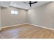 A basement area features laminate flooring, ceiling fan, and recessed lighting providing potential for an extra space at 515 Lynton Way, Westfield, IN 46074