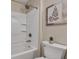 Shower and toilet area of bathroom featuring a shower head and decorative fern art at 515 Lynton Way, Westfield, IN 46074