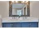 Contemporary bathroom featuring a dual sink vanity, decorative tile mirror accent wall, and modern fixtures at 515 Lynton Way, Westfield, IN 46074