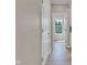 Clean hallway showcasing hardwood floors, white doors, and a bright, airy feel with natural light at 515 Lynton Way, Westfield, IN 46074