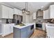 Contemporary kitchen with stainless steel appliances, center island, and sleek white cabinetry at 515 Lynton Way, Westfield, IN 46074