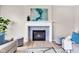 Cozy living room with a stylish fireplace, comfortable seating, and contemporary decor and gray accent pillows at 515 Lynton Way, Westfield, IN 46074
