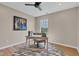 Office space with stylish desk, chair, and patterned rug, enhanced by natural light and art at 515 Lynton Way, Westfield, IN 46074