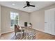 Bright office with a desk, large window, ceiling fan, and stylish decor at 515 Lynton Way, Westfield, IN 46074