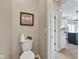 Bright powder room featuring modern fixtures, decor, and convenient access to the kitchen area at 515 Lynton Way, Westfield, IN 46074