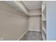 Spacious walk-in closet with rod, shelf, and carpet flooring offers ample storage solutions at 515 Lynton Way, Westfield, IN 46074