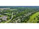 An aerial view of a well-maintained neighborhood with lush trees and green spaces at 5325 Ridge Hill Way, Avon, IN 46123