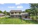 The backyard features a brick patio, fire pit, and a sprawling green lawn at 5325 Ridge Hill Way, Avon, IN 46123