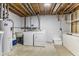 Basement area featuring a utility sink, washer and dryer, and other mechanical components at 5325 Ridge Hill Way, Avon, IN 46123
