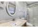 Bright bathroom features a walk-in shower, granite countertop, decorative mirror, and natural light at 5325 Ridge Hill Way, Avon, IN 46123