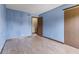 Light blue bedroom features vinyl wood floors, trim, natural light, and closet at 5325 Ridge Hill Way, Avon, IN 46123