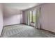 Bedroom features gray carpeted floors, neutral paint, natural light, and baseboard trim at 5325 Ridge Hill Way, Avon, IN 46123