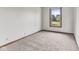 Neutral bedroom with carpeted floors, trim details, natural light, and a verdant outdoor view at 5325 Ridge Hill Way, Avon, IN 46123