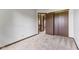 Cozy carpeted bedroom features a closet, trim details, neutral decor, and an interior hallway view at 5325 Ridge Hill Way, Avon, IN 46123