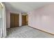 Bedroom features gray carpeted floors, neutral paint, natural light, trim, and a closet at 5325 Ridge Hill Way, Avon, IN 46123