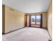 Inviting bedroom with neutral walls, plush carpeting, and a sunlit window at 5325 Ridge Hill Way, Avon, IN 46123