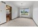 Open dining room with a chandelier, large window with a view of the backyard, and access to the kitchen at 5325 Ridge Hill Way, Avon, IN 46123