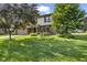 Charming two-story home featuring a brick and vinyl exterior, lush landscaping, and an attached two-car garage at 5325 Ridge Hill Way, Avon, IN 46123
