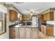 Charming kitchen featuring ample counter space, wood cabinetry, and stainless steel appliances at 5325 Ridge Hill Way, Avon, IN 46123