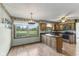 Inviting eat-in kitchen with wood cabinets, stainless steel appliances, and picturesque backyard view at 5325 Ridge Hill Way, Avon, IN 46123