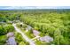 Aerial view of home in lush, green neighborhood, highlighting its desirable location and surroundings at 5404 Cayman Dr, Carmel, IN 46033