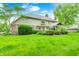Expansive backyard with lush lawn and mature trees, offering a serene outdoor space at 5404 Cayman Dr, Carmel, IN 46033