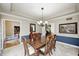 Dining room with wood table and chairs, wainscoting, and access to other rooms at 5404 Cayman Dr, Carmel, IN 46033